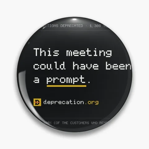 Pin printed with “This meeting could have been a prompt.”